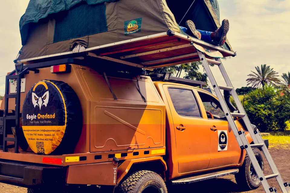Eagle Overland Hilux with an open rooftop tent and ladder